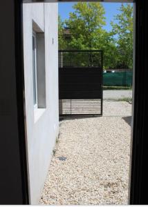 a view from a door of a building with a gate at Duplex CATALINA 2 in La Plata