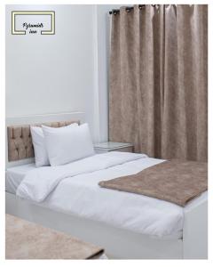 Letto o letti in una camera di Egyptus Pyramids Inn