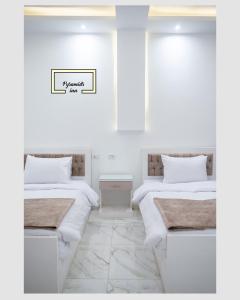 Letto o letti in una camera di Egyptus Pyramids Inn