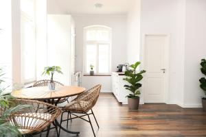 a dining room with a table and chairs at Villa Alexandra 1897 Wohnung Maria in Bad Wildungen