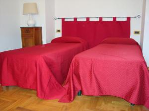 Кровать или кровати в номере Affitta camere Il Ruscello