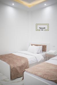 Letto o letti in una camera di Egyptus Pyramids Inn