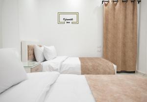 Letto o letti in una camera di Egyptus Pyramids Inn