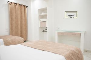 Letto o letti in una camera di Egyptus Pyramids Inn