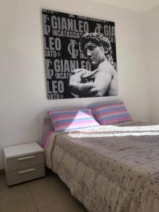 Un pat sau paturi într-o cameră la Gianleo Suite vista mare
