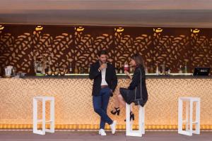 a man and a woman standing at a bar at BessaHotel Liberdade in Lisbon +37 photos