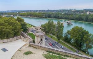 a bridge over a river with cars on a road at Nice Home In Le Pontet With Kitchen in Avignon
