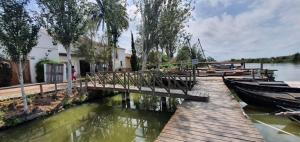 a dock with two boats on the water at Habitación cerca del centro in Valencia