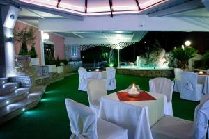 a banquet hall with white tables and white chairs at HOTEL RISTORANTE SAN GIOVANNI in Falerna +19 photos