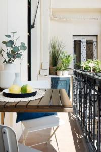 a table with a bowl of fruit on a balcony at Alassio Vayadu' Arabesque in Alassio