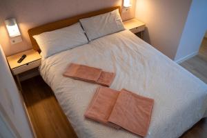 Postel nebo postele na pokoji v ubytování La Siesta Hostel