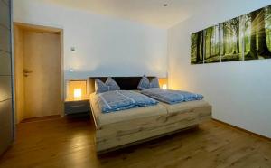a bedroom with a bed with two pillows on it at STADTOASE Frankenberg - Adults Only - Moderne Apartments mit Balkon nahe Chemnitz - Monteure willkommen in Frankenberg