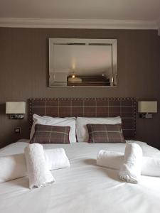 Letto o letti in una camera di Anchor Hotel and Seabed Restaurant