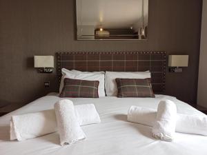 Letto o letti in una camera di Anchor Hotel and Seabed Restaurant