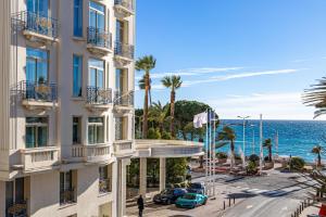 a view of the ocean from a building at Bel appartement 3P Croisette*Cannes in Cannes