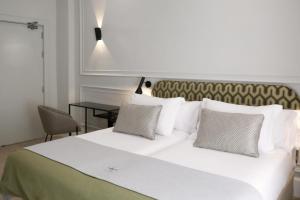 Posteľ alebo postele v izbe v ubytovaní Casa Romana Hotel Boutique