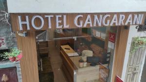 a hotel caravan sign on the front of a building at HOTEL GANGARANI in Haridwār
