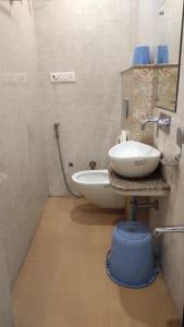 a bathroom with a white sink and a mirror at HOTEL GANGARANI in Haridwār