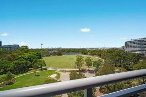 a view of a park from a balcony at Shyline Views - Beautiful Condo In Wolli Creek in Sydney