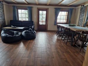 a living room with a couch and a table at Piligrimo sodyba in Kadarės