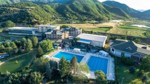 an aerial view of a resort with a swimming pool and mountains at Hotel Sirius Spa & Wellness in Strumica