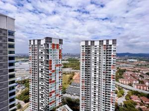 two tall buildings standing next to each other in a city at Duplex 4PX Free Parking @ ICITY, Near SOGO & ThemePark in Shah Alam