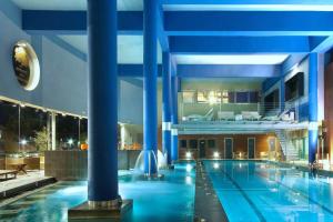 The swimming pool at or close to Mara's Apartments Higueron West - Like A House - 246 Square Meters of Private Terrace & Garden - Morning and Evening Sun