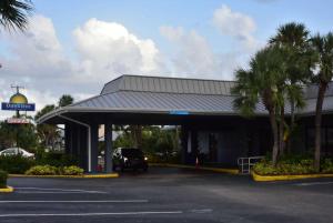 a gas station with a car parked in a parking lot at Days Inn by Wyndham Stuart in Stuart