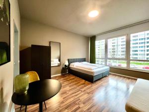 Postel nebo postele na pokoji v ubytování N8 ROOMS - by Leipzig Suites