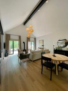 a living room with a table and a couch at The Haskell Accommodation Collection in Stellenbosch