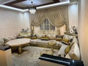 a living room with a couch and a table at casa hermosa in Agadir