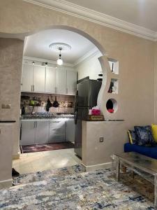 a kitchen with an archway in the middle of a room at casa hermosa in Agadir