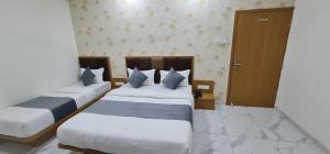 Hotel Vivan客房内的一张或多张床位