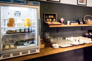 an open refrigerator with food inside of it at Fasthotel Limoges in Limoges