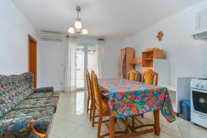 a living room with a table and a couch at Apartment Nena in Novigrad Istria