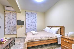 Ένα ή περισσότερα κρεβάτια σε δωμάτιο στο Katerina's Apartment