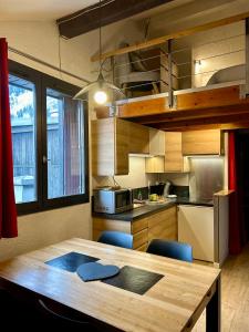 Кухня или кухненски бокс в Appartement Duplex Forclaz