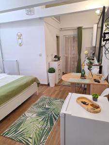 a bedroom with a bed and a table at Várfal apartman II in Eger +37 photos