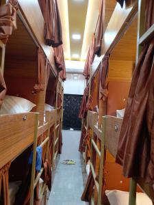 a group of bunk beds in a dorm room at Kufa PG Dormitory in Mumbai