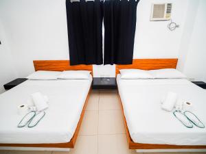 Voodi või voodid majutusasutuse CJS Boracay Joint toas