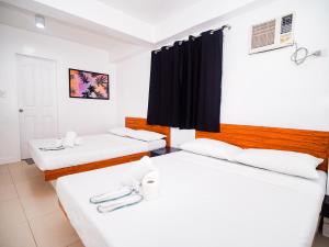 Voodi või voodid majutusasutuse CJS Boracay Joint toas