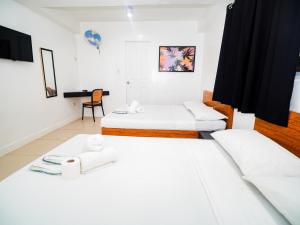 Voodi või voodid majutusasutuse CJS Boracay Joint toas