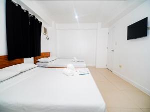 Voodi või voodid majutusasutuse CJS Boracay Joint toas
