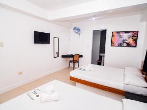 Voodi või voodid majutusasutuse CJS Boracay Joint toas
