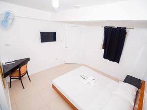 Voodi või voodid majutusasutuse CJS Boracay Joint toas