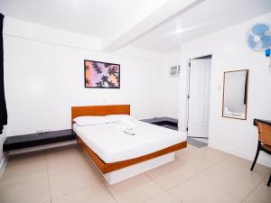Voodi või voodid majutusasutuse CJS Boracay Joint toas