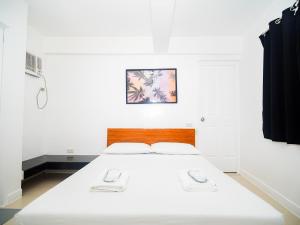 Voodi või voodid majutusasutuse CJS Boracay Joint toas