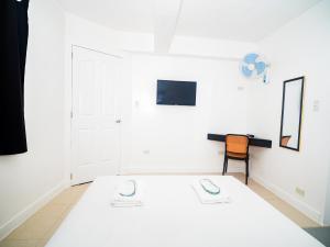 Voodi või voodid majutusasutuse CJS Boracay Joint toas