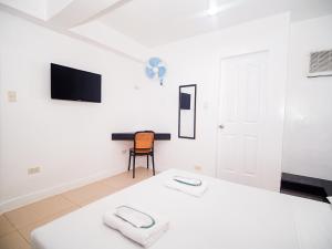 Voodi või voodid majutusasutuse CJS Boracay Joint toas