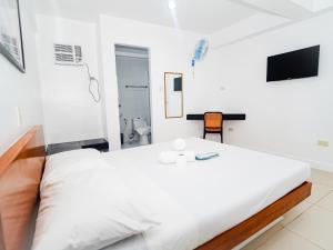 Voodi või voodid majutusasutuse CJS Boracay Joint toas